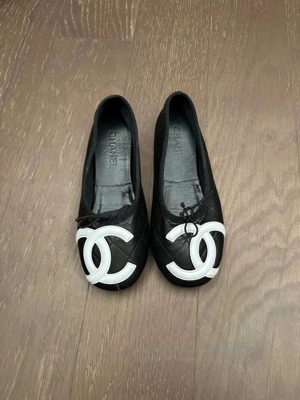 CHANEL Black Leather Ballet Flats with White CC Appliqué